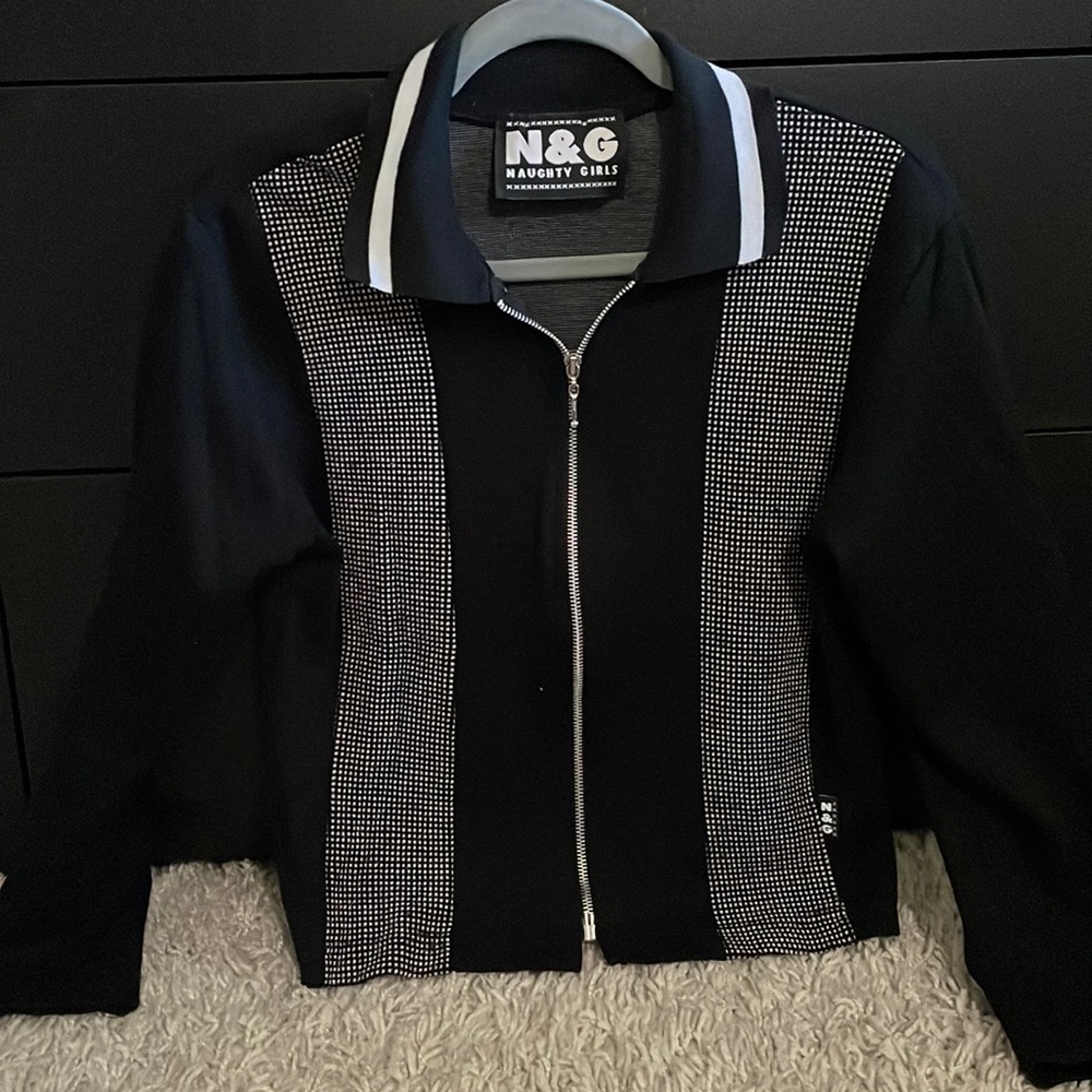 Black/white zip up top.  Size S.